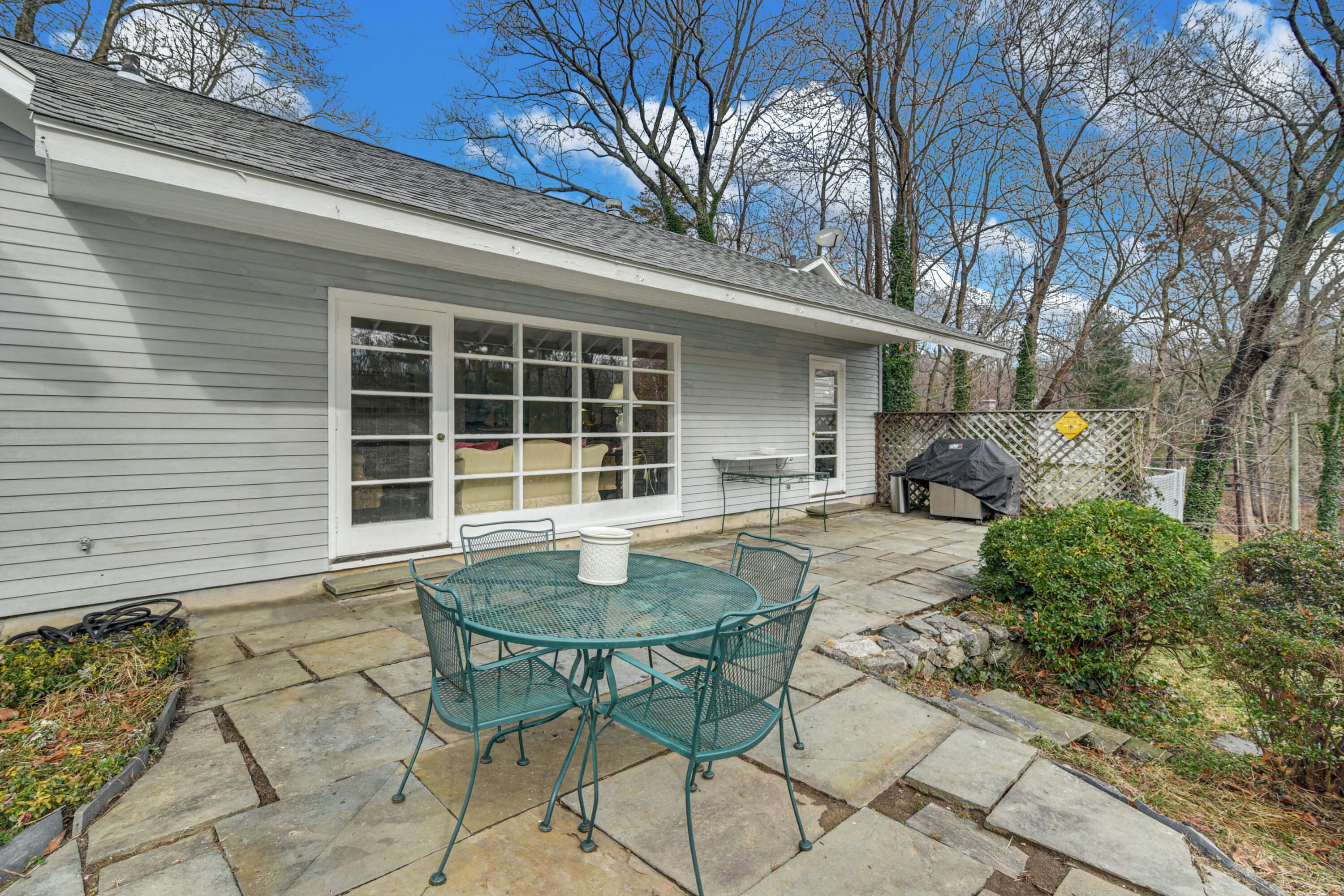 25 Goodwives River Road Darien, CT 06820 - Photo 14 of 17 a view of house with backyard and sitting area