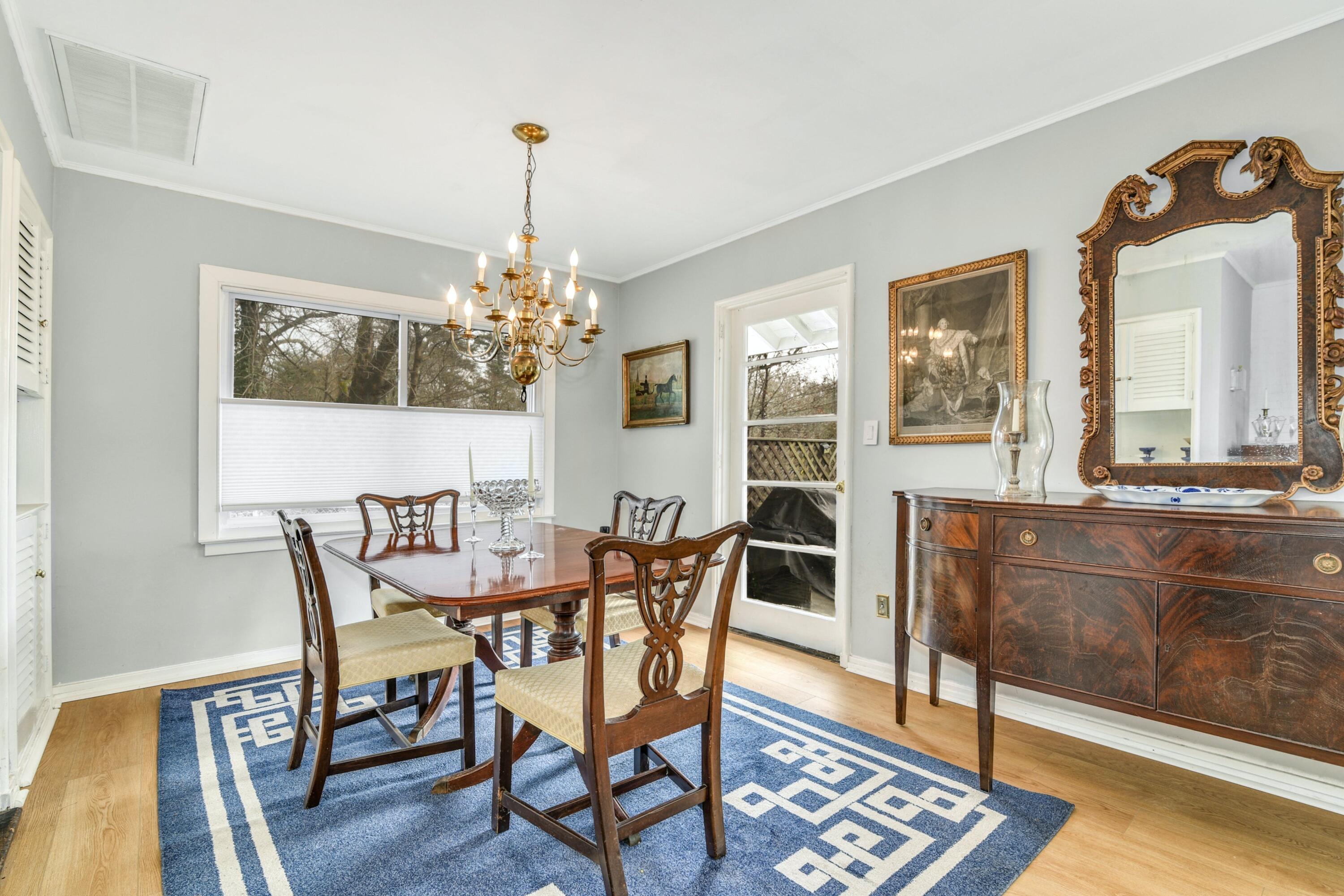 25 Goodwives River Road Darien, CT 06820 - Photo 2 of 17 a view of a dining room with furniture window and wooden floor