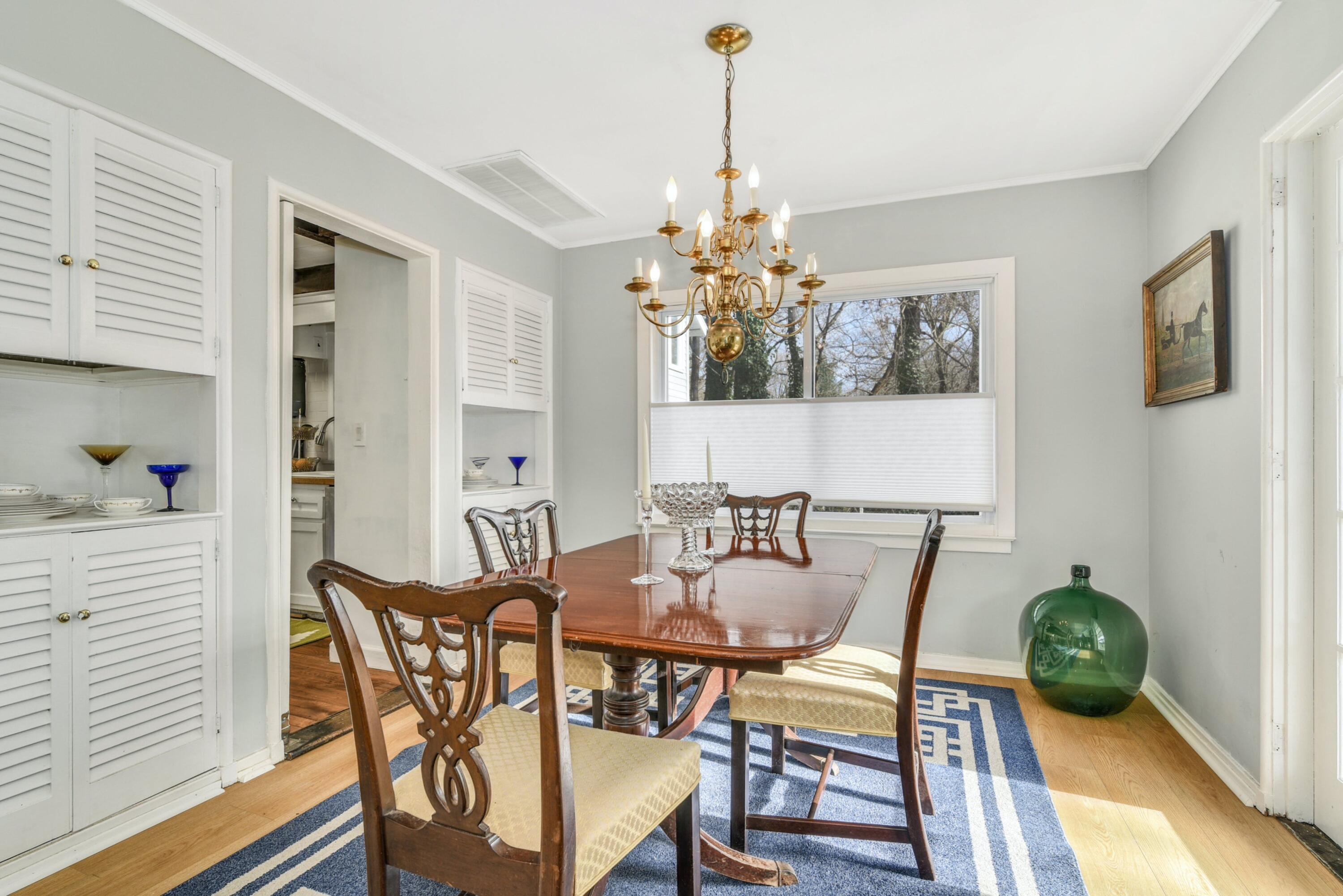 25 Goodwives River Road Darien, CT 06820 - Photo 3 of 17 a view of a dining room with furniture and chandelier