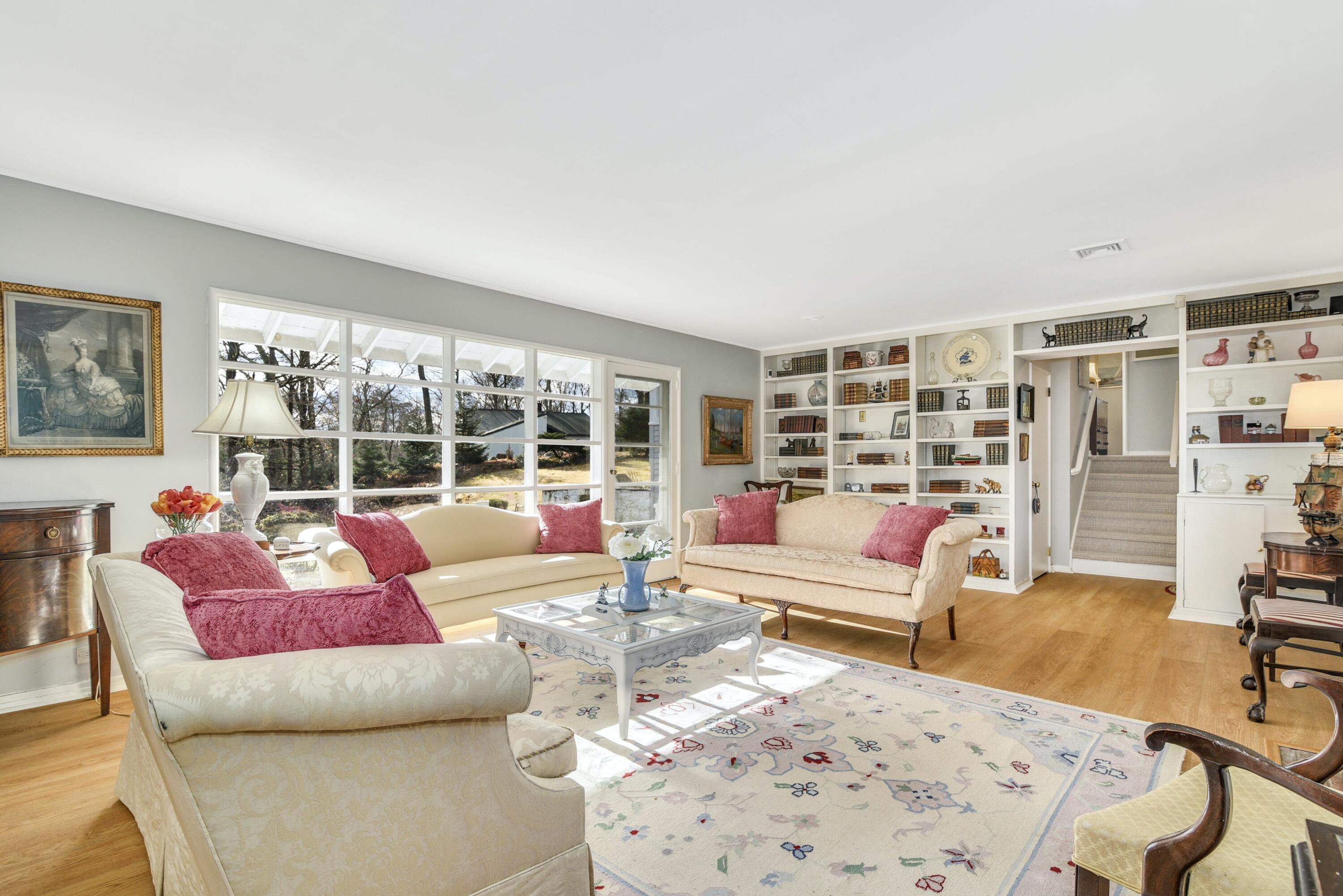 25 Goodwives River Road Darien, CT 06820 - Photo 4 of 17 a living room with furniture and a large window