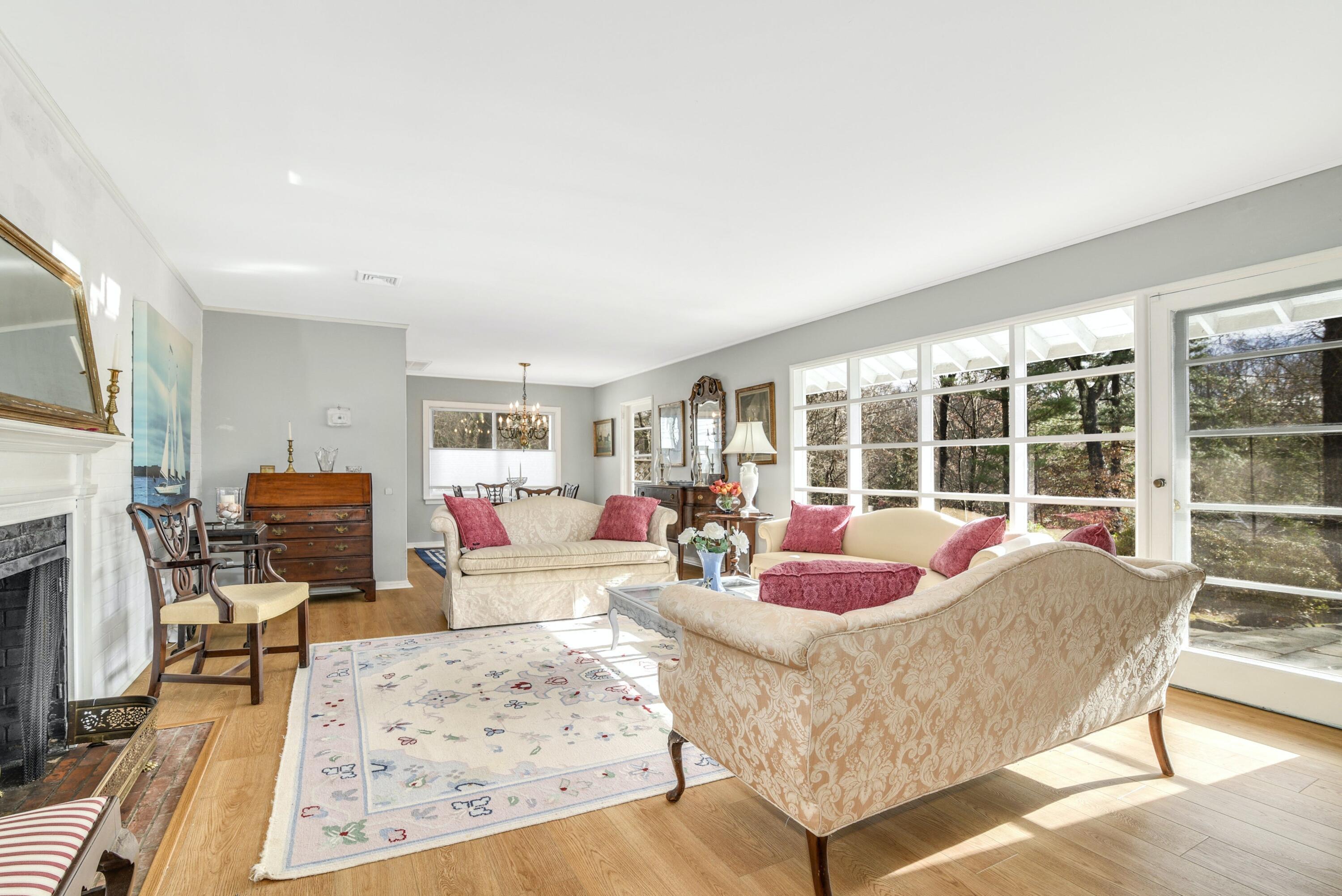 25 Goodwives River Road Darien, CT 06820 - Photo 5 of 17 a living room with furniture large window and flat screen tv