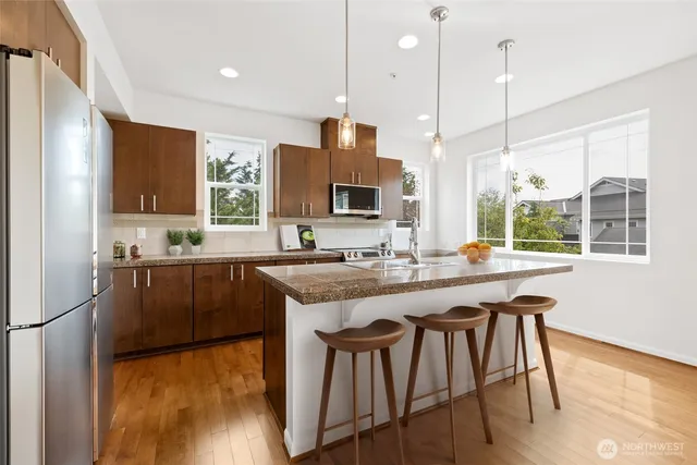 a view of a dining room with furniture and wooden floor
