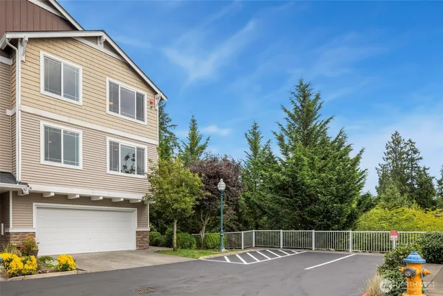 a view of a house with a yard and plants