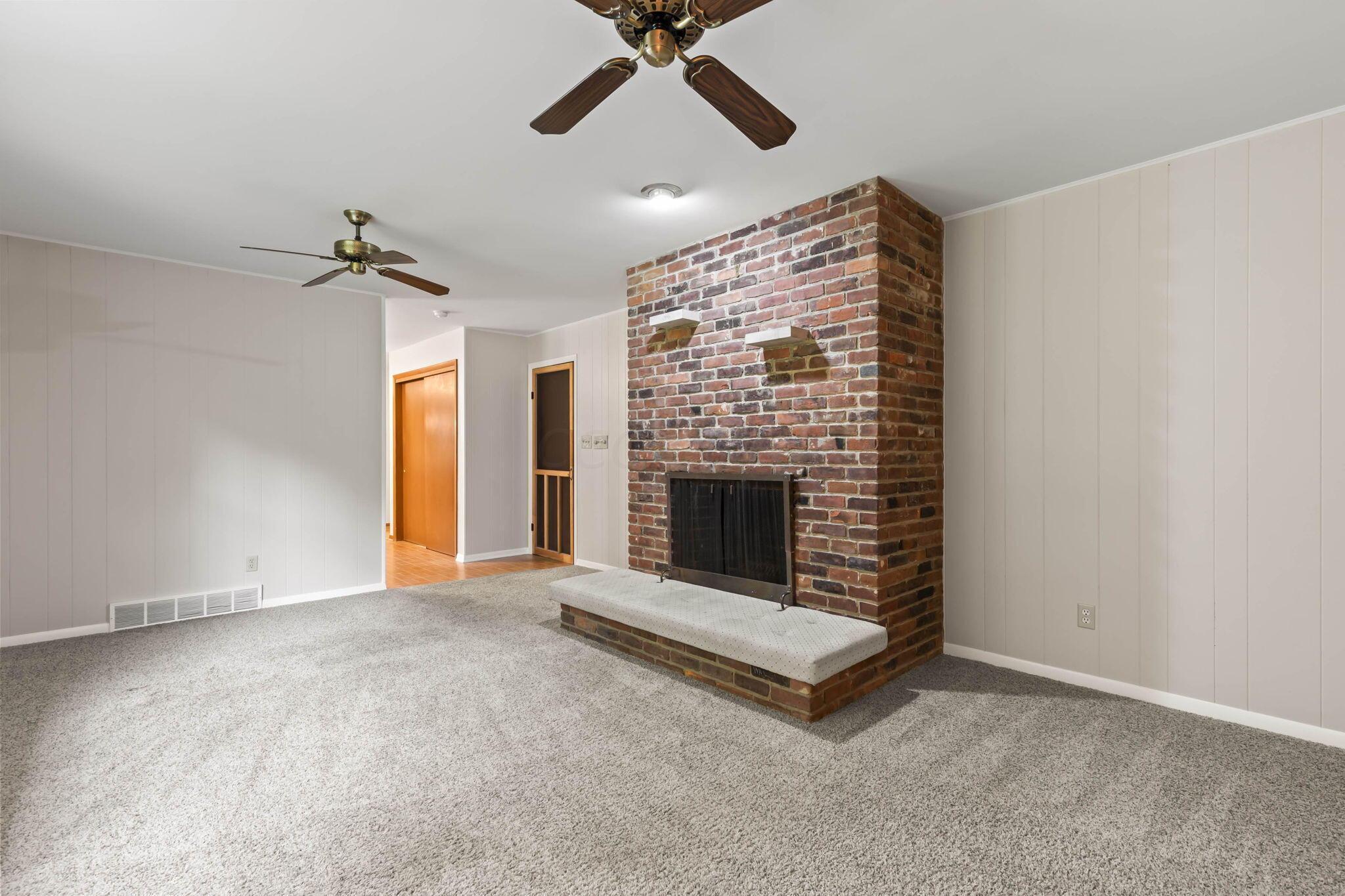 999 Birchmont Road Columbus, OH 43220 - Photo 22 of 53 The family room fireplace has a cushioned hearth and recessed lighting as well.