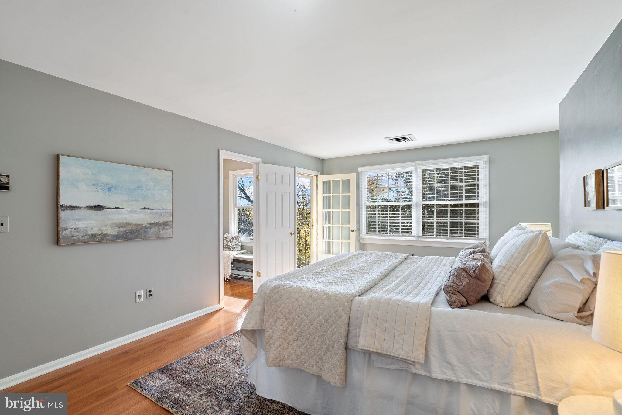 8007 Strauff Road, Unit 16 Towson, MD 21204 - Photo 22 of 49 a large bed sitting in a bedroom next to a window