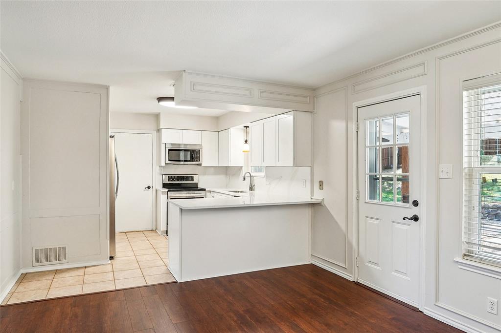 1506 Springbrook Street Corinth, TX 76210 - Photo 12 of 40 New quartz countertops, sink, cabinets and Dishwasher