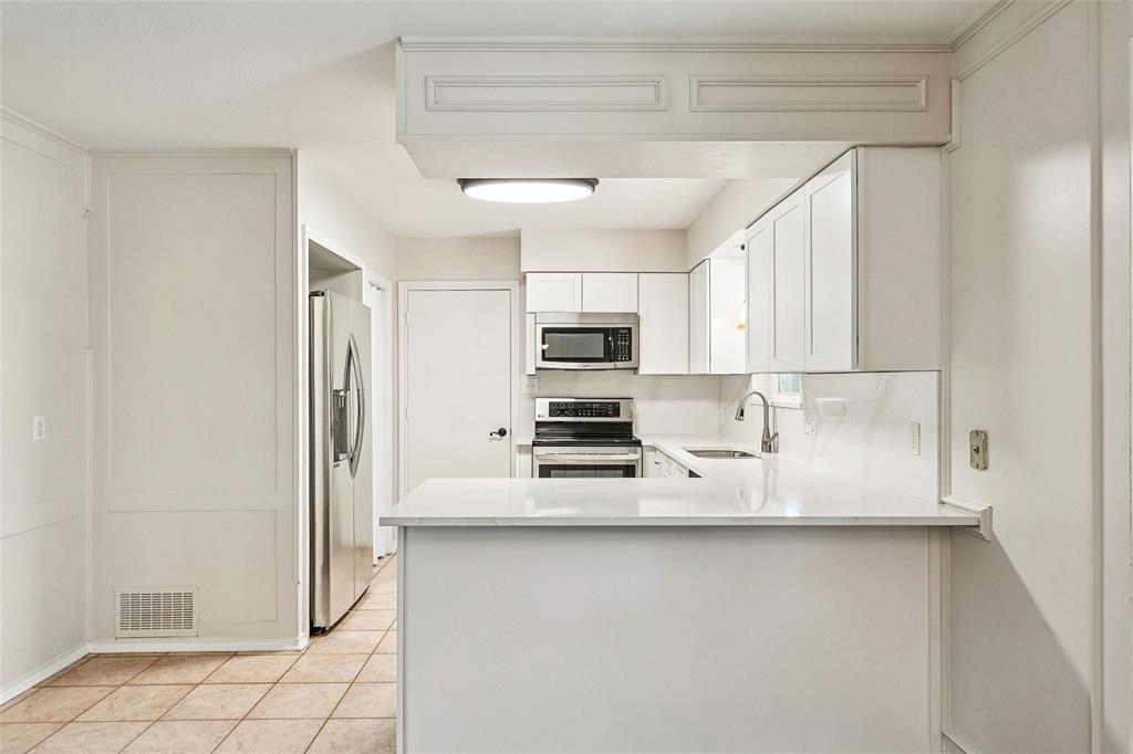 1506 Springbrook Street Corinth, TX 76210 - Photo 13 of 40 New quartz countertops, sink, cabinets and Dishwasher
