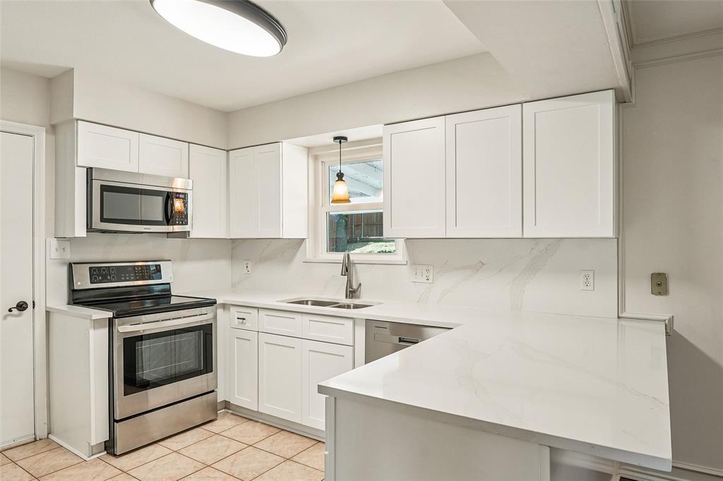 1506 Springbrook Street Corinth, TX 76210 - Photo 14 of 40 New quartz countertops, sink, cabinets and Dishwasher