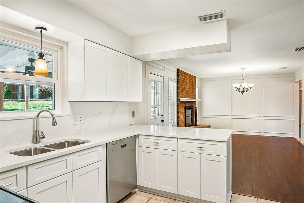 1506 Springbrook Street Corinth, TX 76210 - Photo 16 of 40 New quartz countertops, sink, cabinets and Dishwasher