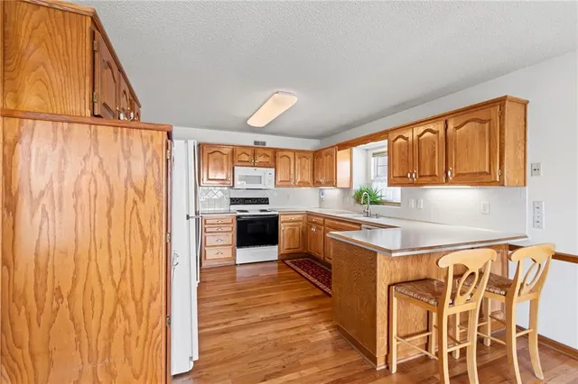 $360,000 | 1020 Northeast Woodbury Lane, Lee's Summit, MO 64086