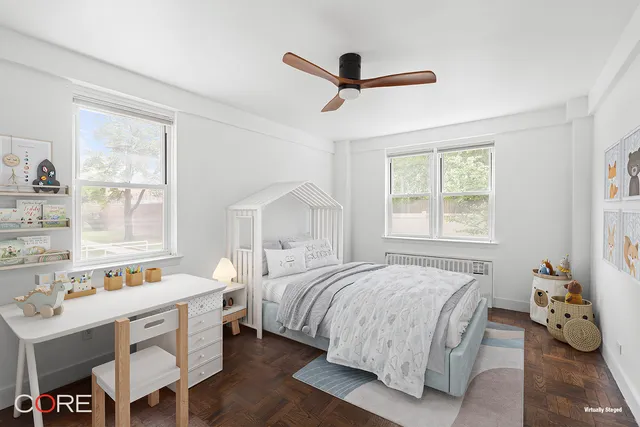 a bed room with a bed and a window