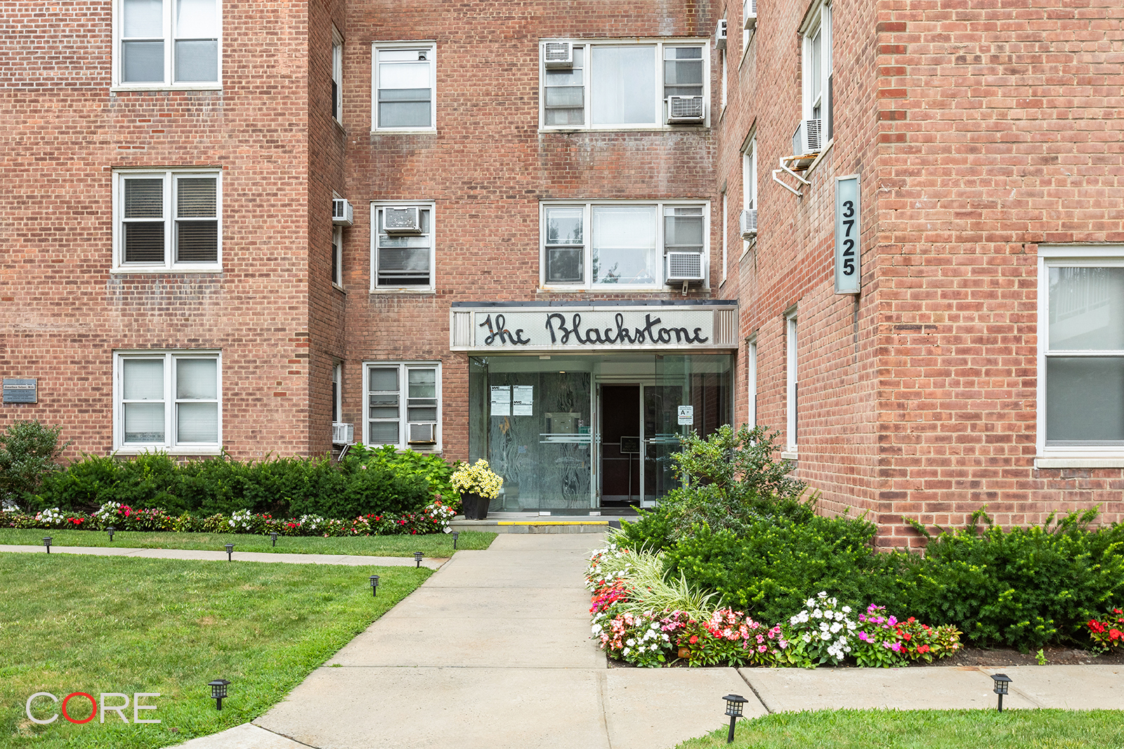 3725 Henry Hudson Parkway West, Unit 2F/2G Bronx, NY 10463 - Photo 9 of 10 a view of a brick building next to a yard
