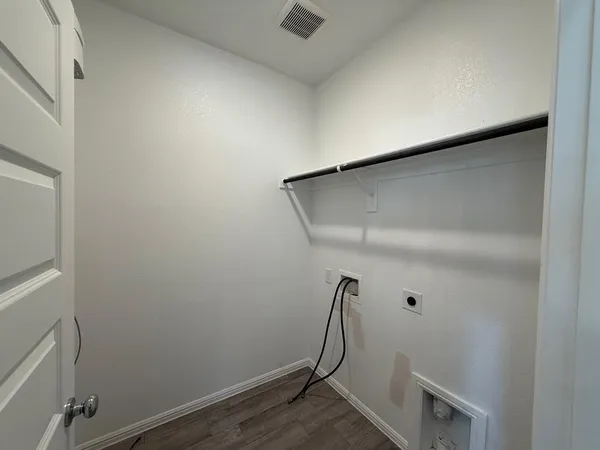 a view of storage and utility room with a bathtub