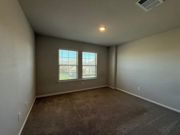 a bathroom with a toilet sink and shower