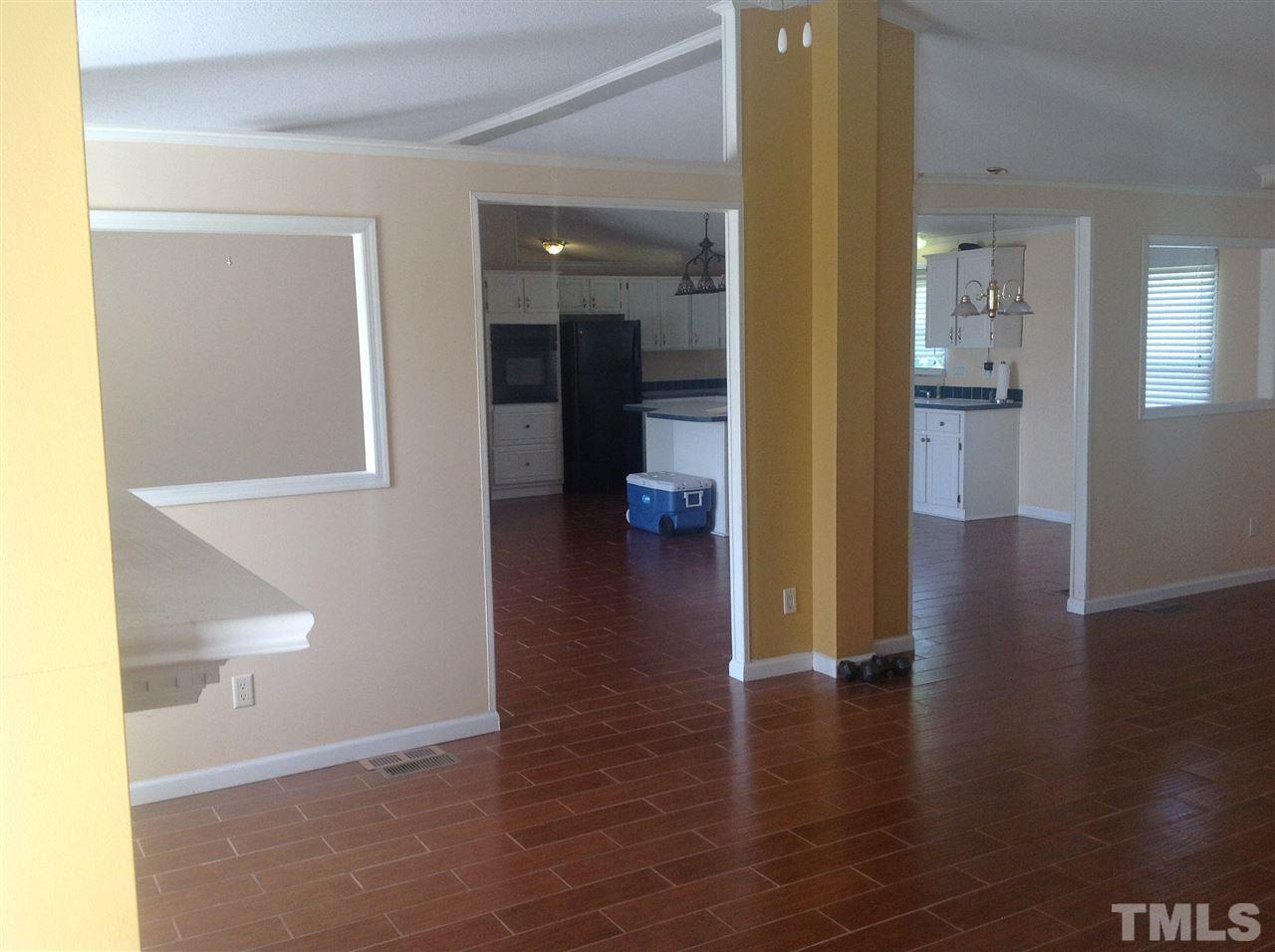 10958 Beaver Dam Road Middlesex, NC 27557 - Photo 14 of 24 a view of a hallway with wooden floor