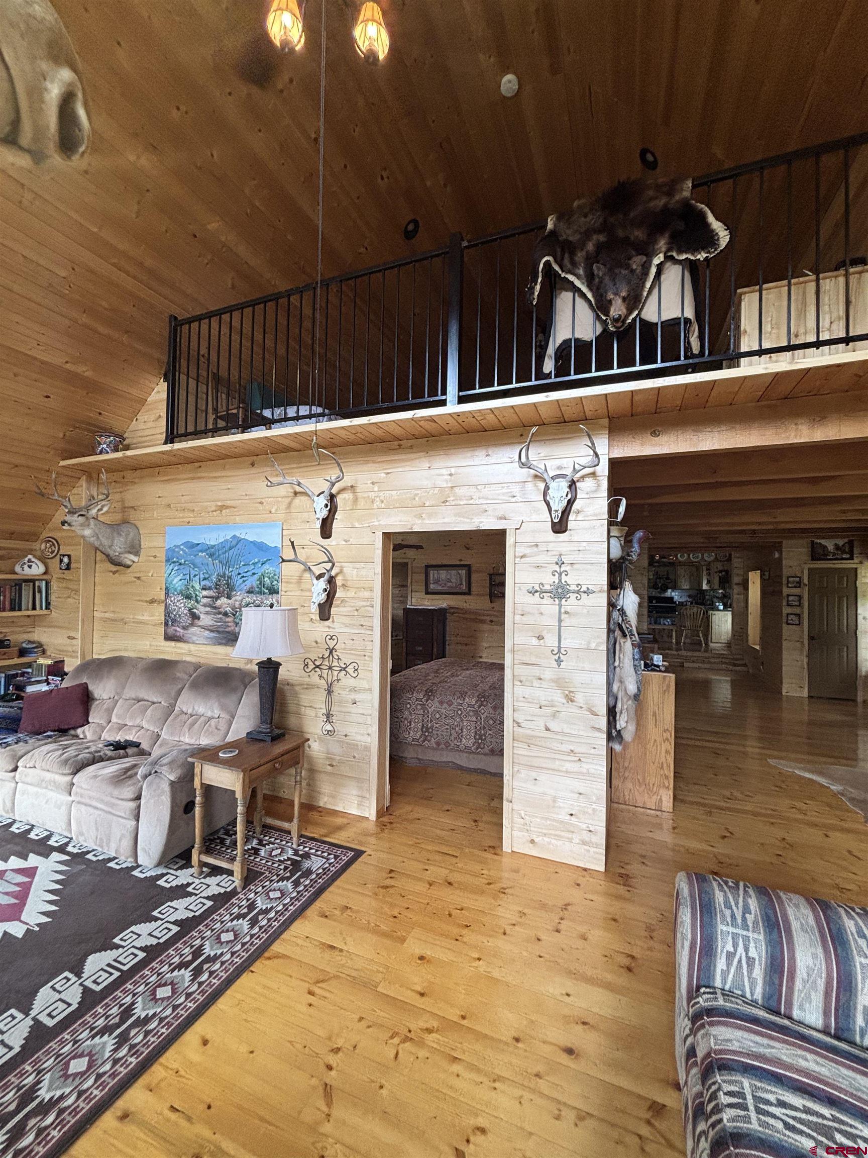 1113 Spring Street Del Norte, CO 81132 - Photo 26 of 43 a view of a living room with furniture