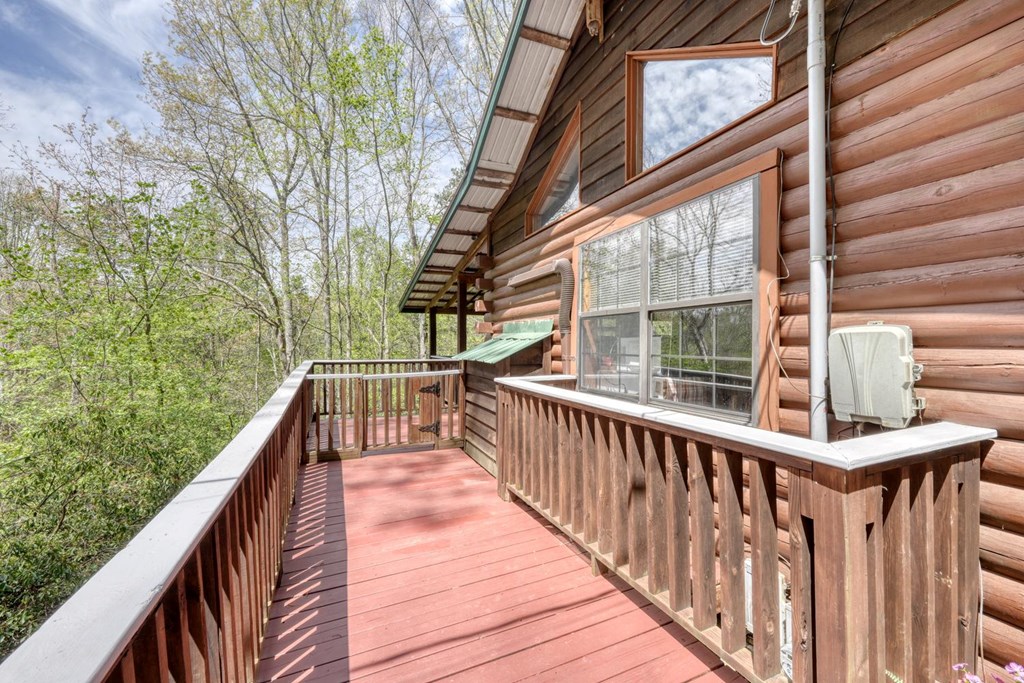 746 High Ridge Road Murphy, NC 28906 - Photo 11 of 44 a view of balcony with couch and wooden floor