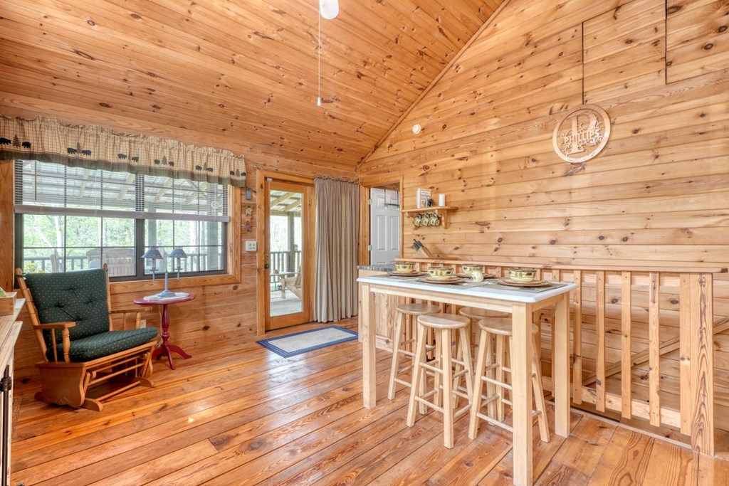 746 High Ridge Road Murphy, NC 28906 - Photo 19 of 44 a living room with a large window wooden floor and furniture