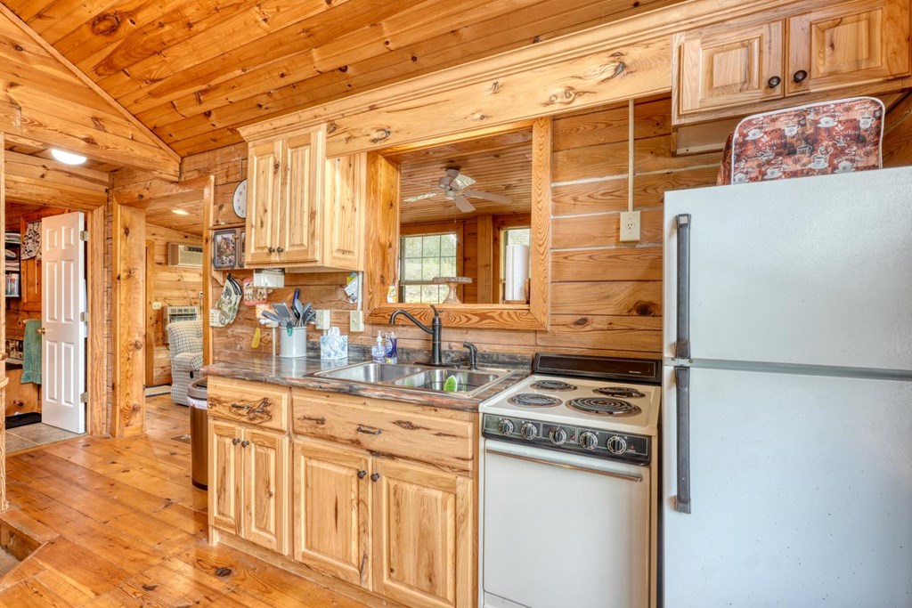746 High Ridge Road Murphy, NC 28906 - Photo 22 of 44 a kitchen with stainless steel appliances a stove and a refrigerator