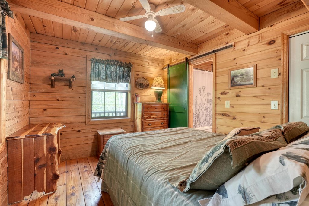 746 High Ridge Road Murphy, NC 28906 - Photo 26 of 44 a bedroom with a bed and a window