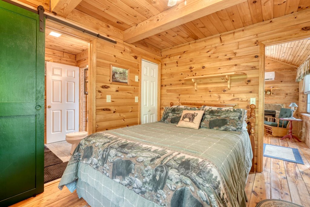 746 High Ridge Road Murphy, NC 28906 - Photo 27 of 44 a bed sitting in a bedroom next to a bathroom