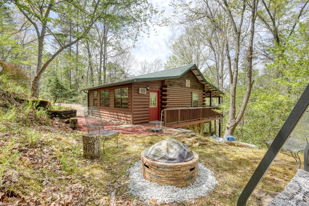 746 High Ridge Road Murphy, NC 28906 - Photo 5 of 44 a backyard of house with a fountain and large trees