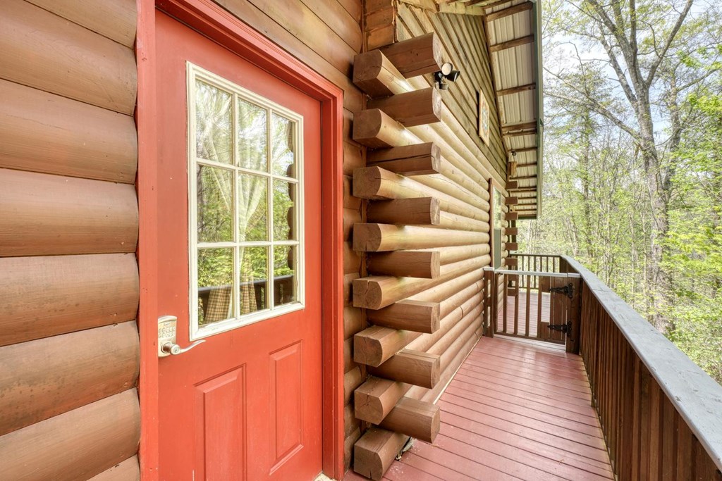 746 High Ridge Road Murphy, NC 28906 - Photo 10 of 44 a view of a balcony with chairs and wooden floor
