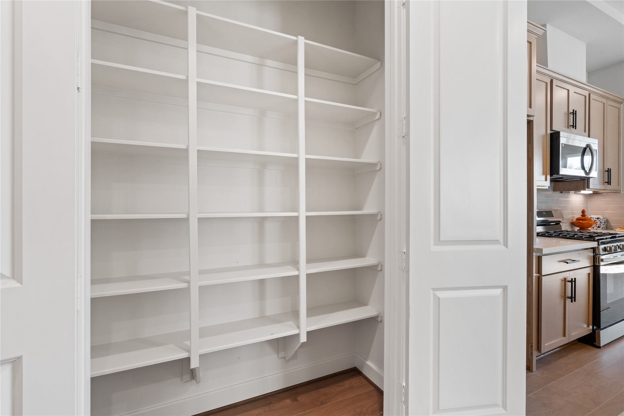 6505 Rena Street Houston, TX 77092 - Photo 9 of 28 Reach-in pantry with full height shelving keeps dry goods and kitchen overflow organized and completely out of sight.