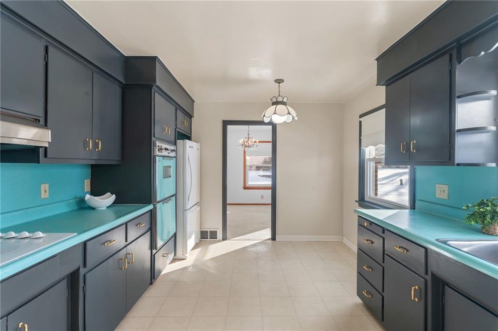 738 Addis Street New Castle, PA 16101 - Photo 14 of 50 a kitchen with stainless steel appliances granite countertop a refrigerator and a sink