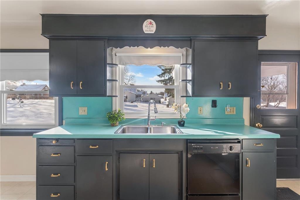 738 Addis Street New Castle, PA 16101 - Photo 15 of 50 a kitchen with a sink and a large mirror