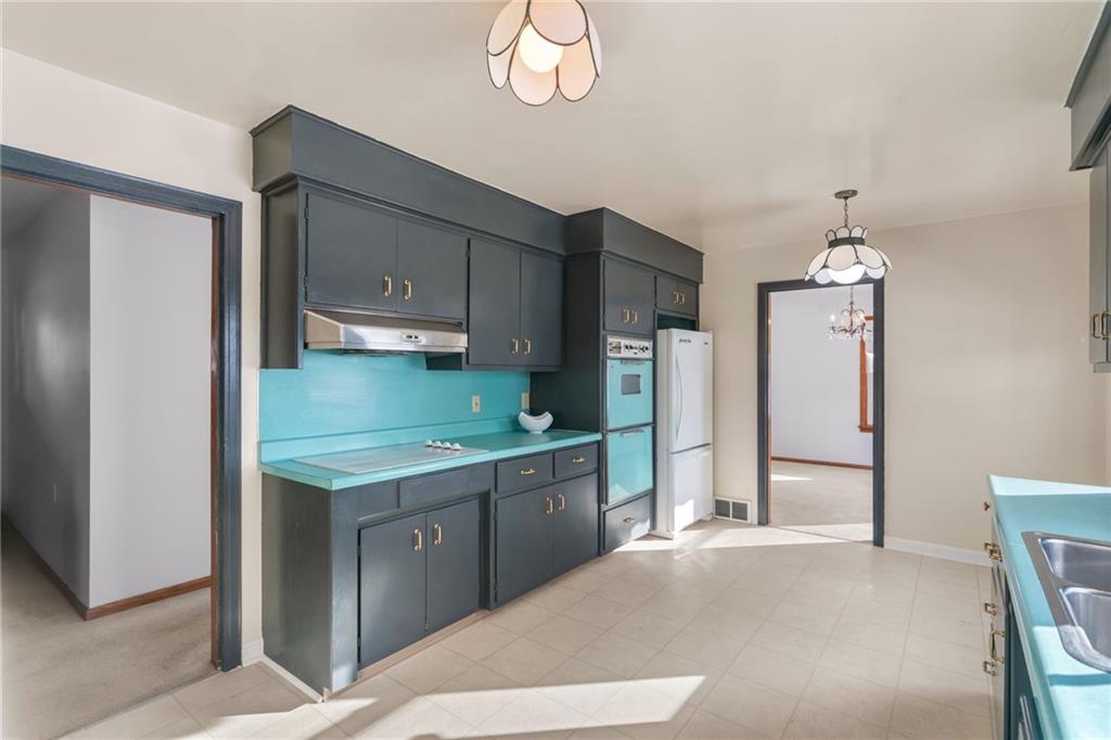 738 Addis Street New Castle, PA 16101 - Photo 17 of 50 a kitchen with stainless steel appliances granite countertop a refrigerator and a stove top oven
