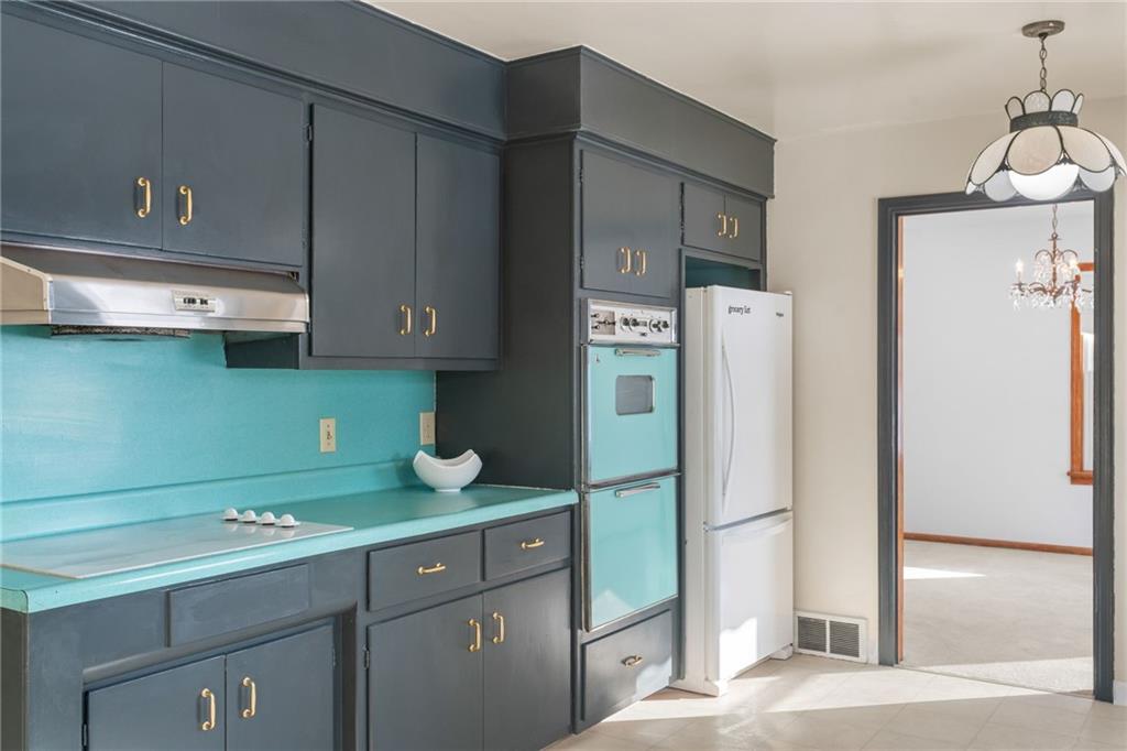 738 Addis Street New Castle, PA 16101 - Photo 18 of 50 a kitchen with a refrigerator and a sink