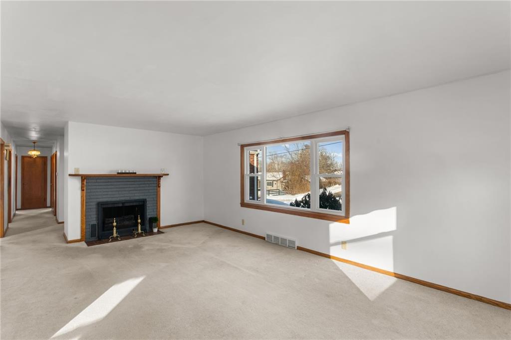 738 Addis Street New Castle, PA 16101 - Photo 3 of 50 an empty room with fireplace and window