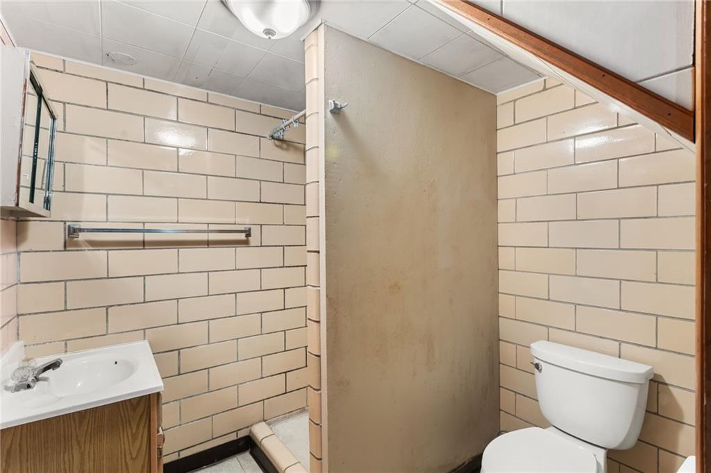 738 Addis Street New Castle, PA 16101 - Photo 42 of 50 a bathroom with a toilet and shower