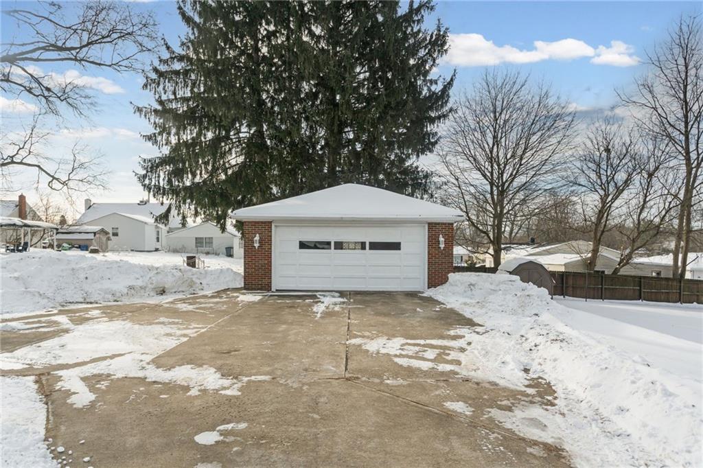 738 Addis Street New Castle, PA 16101 - Photo 46 of 50 a front view of a house with a yard covered in snow