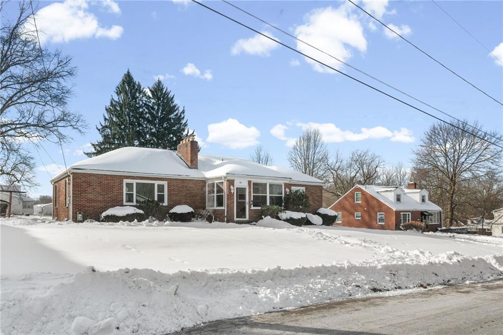 738 Addis Street New Castle, PA 16101 - Photo 49 of 50 a front view of a house with a yard covered with snow