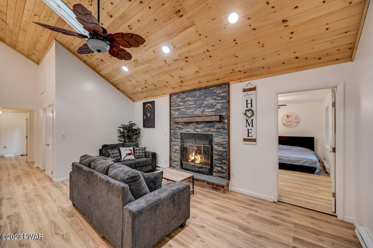 3238 Northgate Road Lake Ariel, PA 18436 - Photo 7 of 49 a living room with furniture and a fireplace