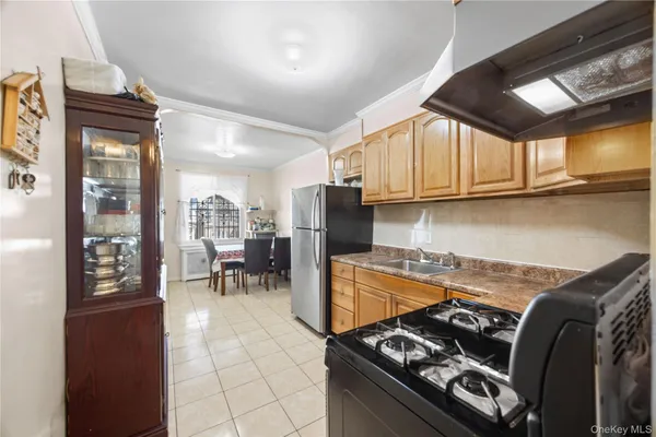 a kitchen with stove and cabinets