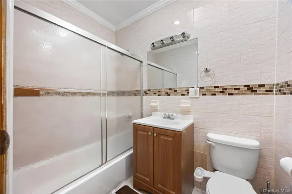 a bathroom with a toilet a sink and a shower