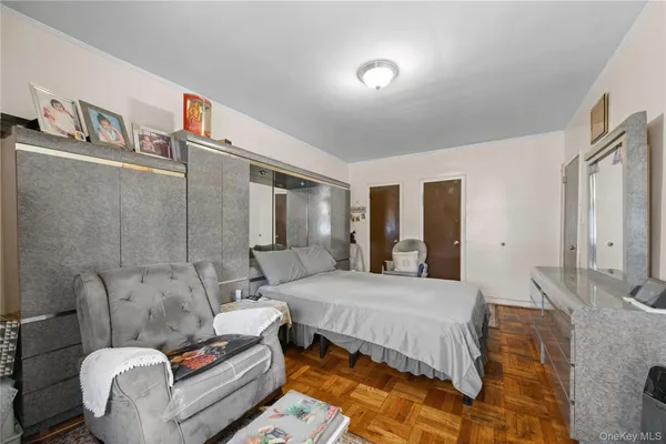 a bedroom with a bed and dresser