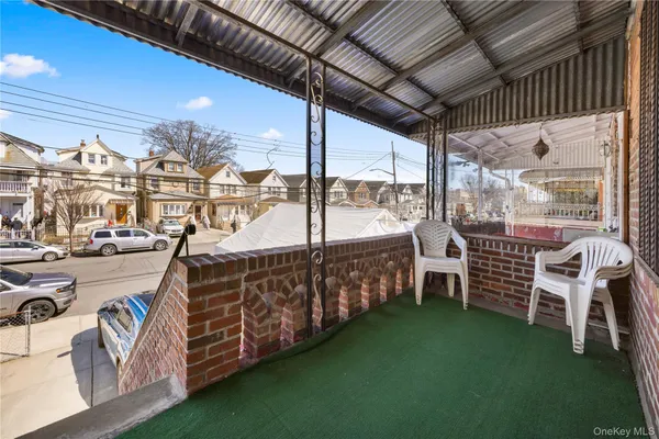 a view of a chairs and table in the balcony