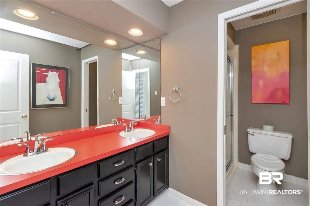 305 Fern Hill Court Mobile, AL 36608 - Photo 34 of 53 Bathroom featuring tile patterned flooring, an enclosed shower, vanity, and toilet
