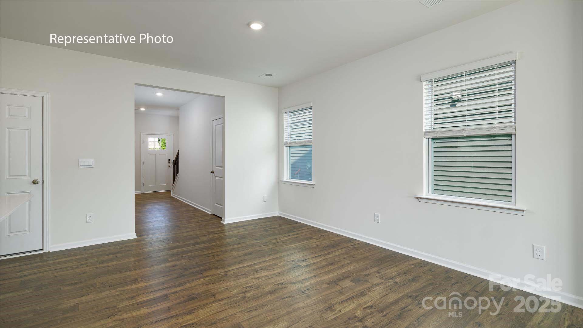 2668 Goose Fair Road Maiden, NC 28650 - Photo 8 of 28 a view of an empty room with wooden floor and a window
