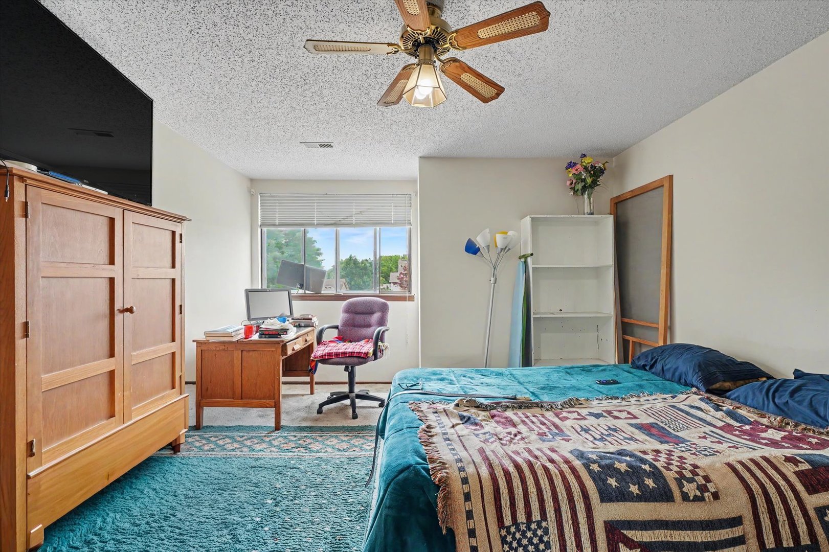 711 Higgins Road Champaign, IL 61822 - Photo 18 of 23 a bedroom with bed and furniture