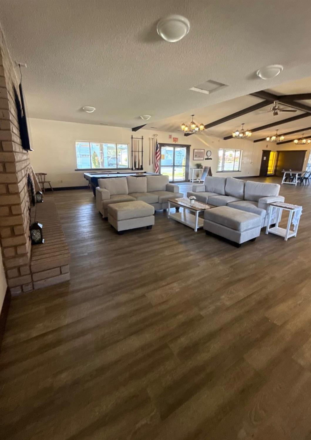 2240 Golden Oak Lane, Unit 104 Merced, CA 95341 - Photo 14 of 19 a living room with furniture and a flat screen tv