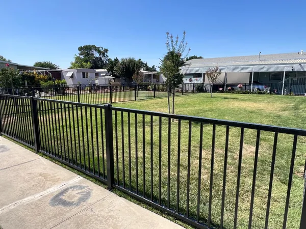 a view of building with a swimming pool