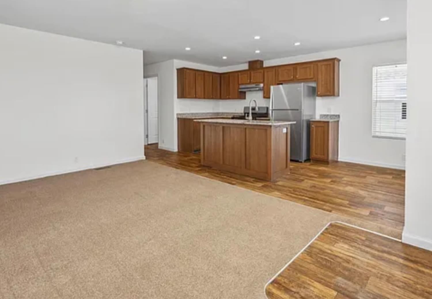 2240 Golden Oak Lane, Unit 104 Merced, CA 95341 - Photo 6 of 19 a kitchen with stainless steel appliances a refrigerator and a microwave