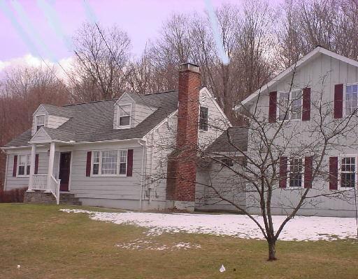 a view of a house with a snow in the yard