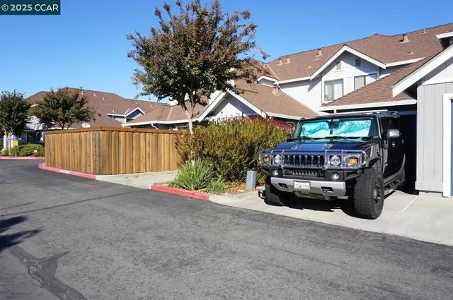 a view of a car park in front of house