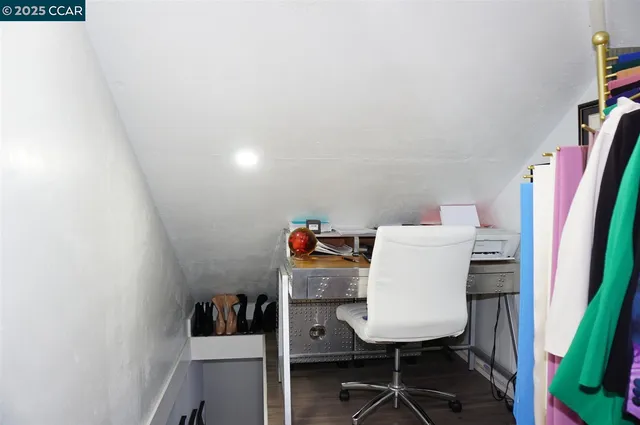 a view of a hallway view with wooden floor and staircase